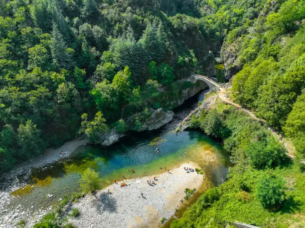 Photo of Le pont du diable or Devil Bridge ain Thueyts village in the Ardeche department in southern France.