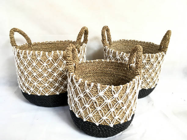 istock Black  and Natural colored Basket weaving combine using cotton thread with handle made from Pandanus odorifer or fragrant screw-pine on a white background for product photography 1465589101