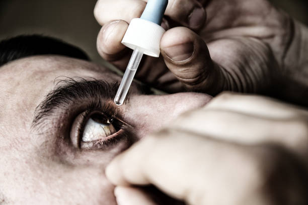 istock Man is putting drops in his eyes. Medical treatment concept. Allergic conjunctivitis problem. 1465590057