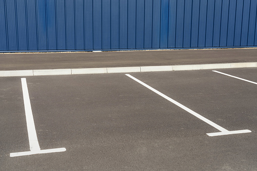 Freshly painted parking lot markings for car parkign spaces.