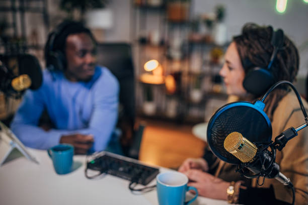 istock People in the podcast studio talking and recording 1465592185