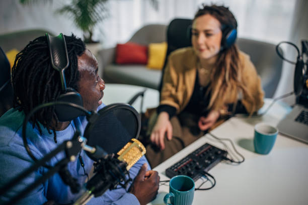 istock People in the podcast studio talking and recording 1465592772