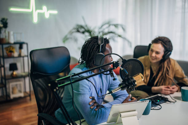 istock People in the podcast studio talking and recording 1465593440