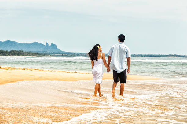 istock Happy Couple Walking on a Hawaiian Beach 1465594240