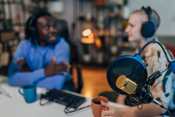 istock People in the podcast studio talking and recording 1465594835