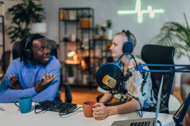istock People in the podcast studio talking and recording 1465595396