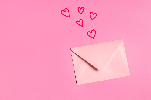 Valentine letter with painted hearts on pink background. This file is cleaned and retouched.