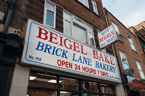 London, UK - February 09, 2023: Name sign on the facade of Beigel Bake bakery shop in Brick Lane. Brick Lane is the heart of the Londons Bangladeshi-Sylheti community.