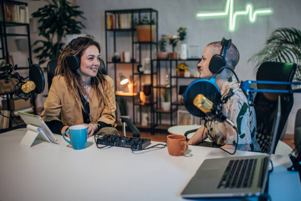 istock Two women in the podcast studio talking and recording 1465596528
