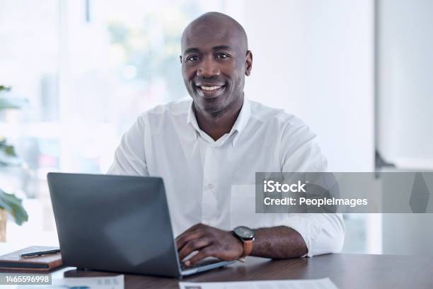 Ceo Black Man And Portrait At Office Laptop With Smile Working On Report For Marketing Company Professional Corporate Worker At Workplace Desk With Document For Project Development Stock Photo - Download Image Now