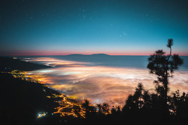 Beautiful natural landscapes on the island of Tenerife, cloud sea, sunset, la Palma, city, volcano, night sky