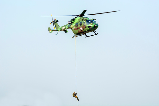 Kolkata, India 15th December 2022. Para commando Slithering and Rappelling from helicopter. Indian Air force demonstrate their capability in front of public.