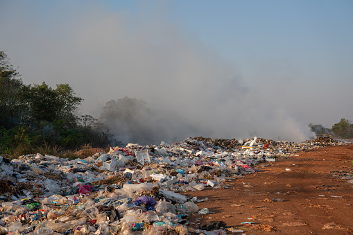 Pile of garbage with smoke to burn at Thailand.