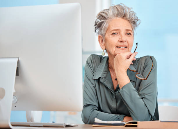 istock Seo, computer or senior woman in digital marketing thinking of strategy, innovation or solution at office desk. Ideas, our vision or mature thoughtful manager planning a development project proposal 1465603699