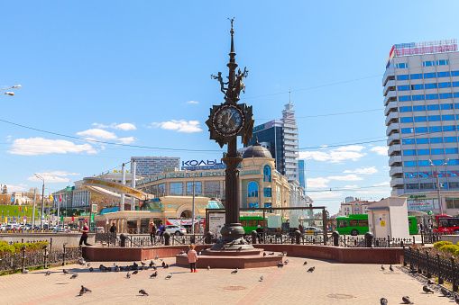 Kazan, Russia - May 7, 2022: Kazan street view with clock tower at Bauman Street, it is a pedestrian street in Kazan, the capital of Tatarstan. Ordinary people walk the street