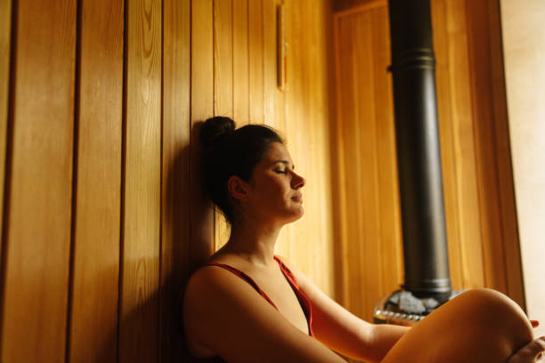istock Woman enjoying the sauna 1465605611