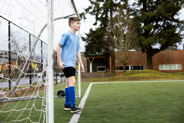 istock Boy Goalie Defending the Goal 1465607522
