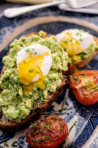 istock Avocado Toast with Poached Egg and Tomatoes 1465609401