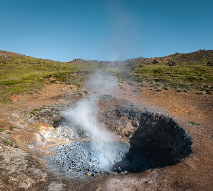 Steaming fumarole at geothermal area in Iceland (Reykjadalur).