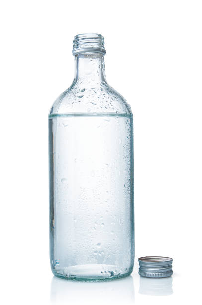 istock Water glass bottle close up on a white background 1465614426