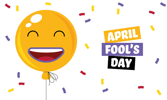 Happy April Fool's day. Yellow background with smiling balloon. Positive emotions