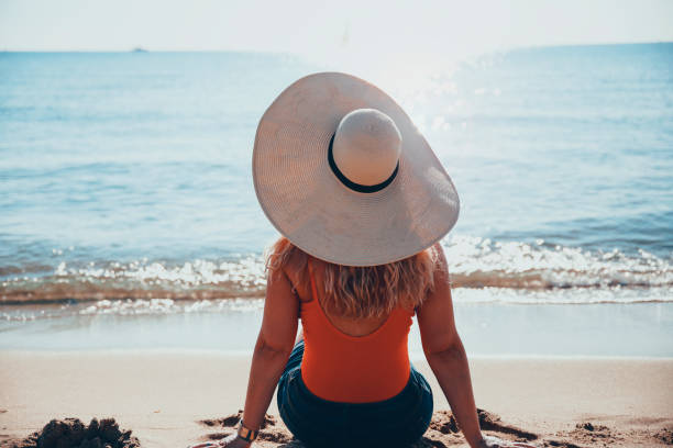 istock Woman Enjoying Sea view 1465616144