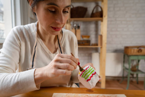istock Woman painting a pottery 1465618769