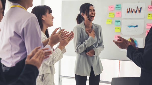 istock Businesswoman proficiently present work project receive celebrations from team . Corporate business team collaboration concept . 1465621396