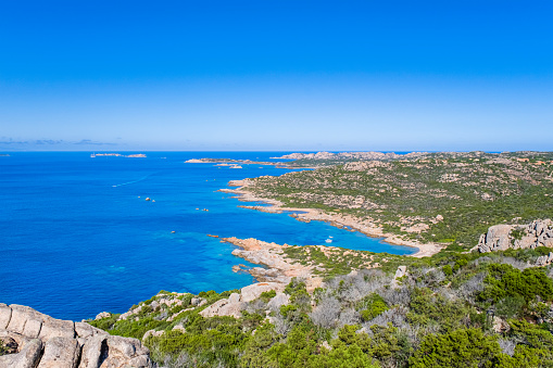 Granite coastline lapped by turquoise colored waters in the northwest of La Maddalena