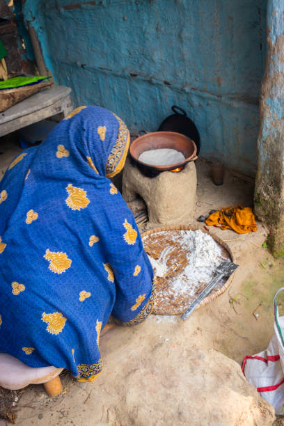 istock women making rice floor bread in traditional soil vessels at wood fire from different angle 1465625870