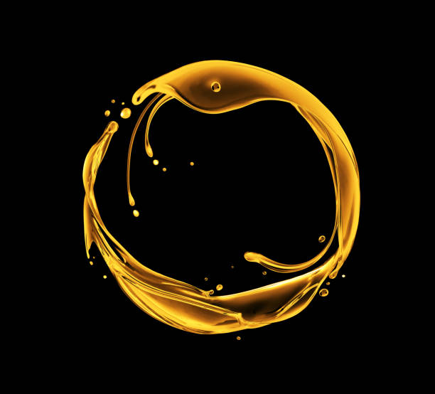 istock Splashes of oily liquid arranged in a circle on a black background 1465627964