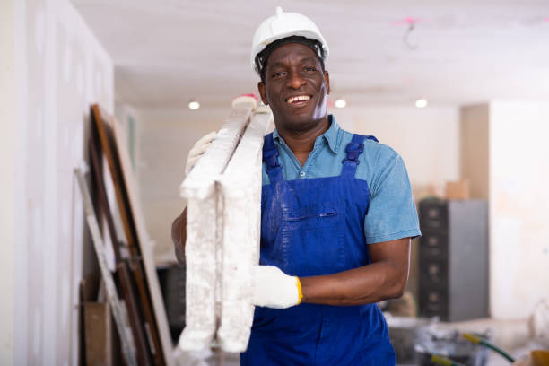 istock African american man builder carrying ladder while working in construction site 1465631448