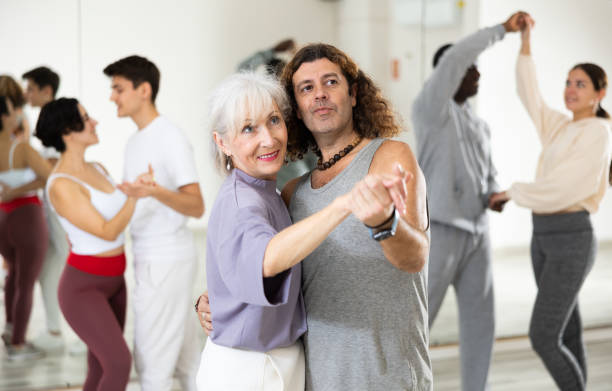 istock Positive couple of dancers learns a slow foxtrot 1465631625