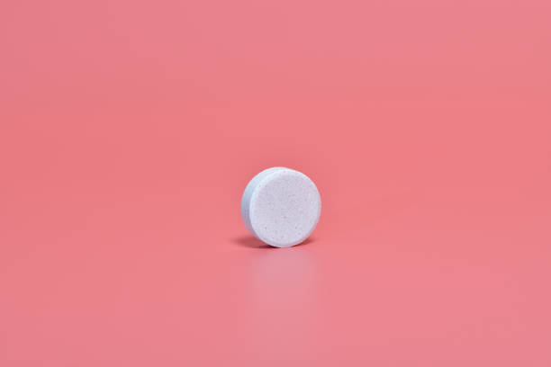 istock Multivitamin effervescent tablet isolated on pink background 1465631942