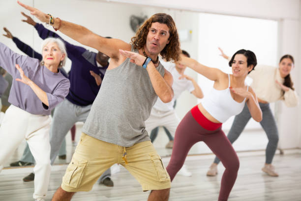 istock Group of adult people practices dance aerobics 1465631992