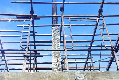 Concrete pillars and scaffoldings at construction site