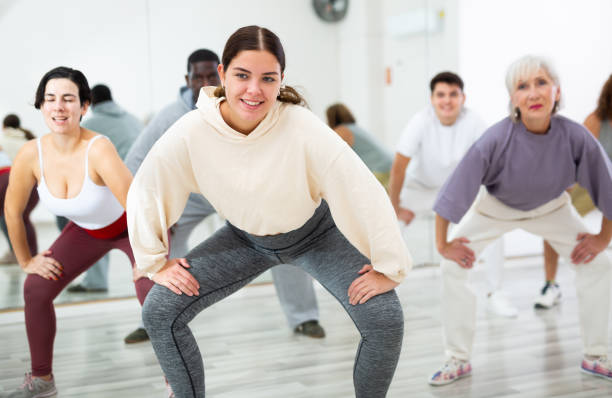 istock Young girl dancing hip hop during group workout 1465632265