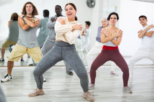 istock Girl learning to dance krump with group in choreographic studio 1465632299