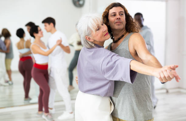 istock Positive couple of dancers learns a slow foxtrot 1465632344