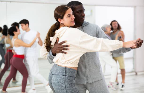 istock Positive couple of dancers learns a slow foxtrot 1465632434
