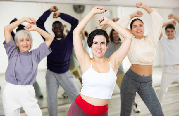 istock Young Hispanic woman learning dynamic dances in choreography class 1465632686