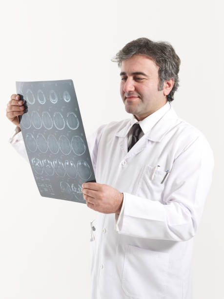 istock Doctor looks at brain scan images 1465632928