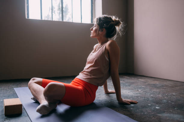 istock A Serious Beautiful Blonde Sportswoman Looking Away While Doing Yoga 1465633766