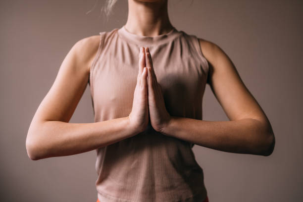 istock An Unrecognizable Sportswoman Doing Yoga With Her Hands Joined 1465633836