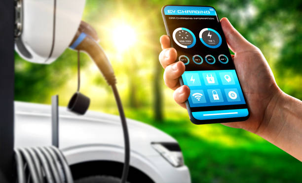 EV charging station for electric car with mobile app display charger status . The electric power is produced from sustainable resources to supply to charger station in order to reduce CO2 emission . estación de carga ev para coche eléctrico con estado del cargador de pantalla de aplicación móvil. la energía eléctrica se produce a partir de recursos sostenibles para suministrar a la estación de carga con el fin de reducir la emisión de co2.