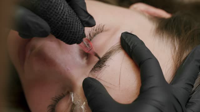 Microblading brows tattooing. Cosmetology procedure.