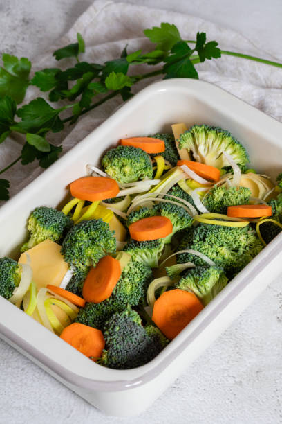 istock Tasty broccoli casserole in baking dish on table. 1465638110