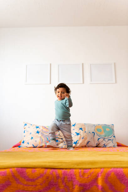 Young child playing in bedroom
