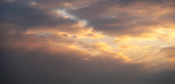 istock Beautiful orange bright sunset sky with dramatic clouds. Sunset sky background. 1465643551