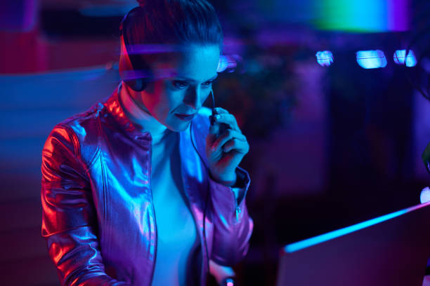 istock stylish woman with headset using laptop 1465645693